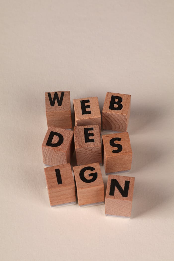 gallery-04 Wooden blocks arranged to spell 'Web Design'. Perfect for creative, digital content themes.
